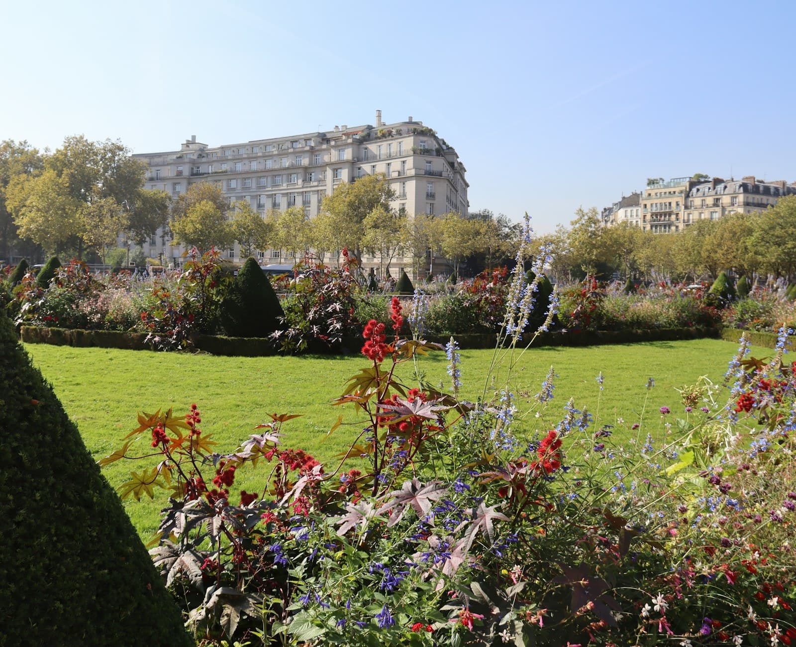 A formal garden of manicured hedging and flowering beds